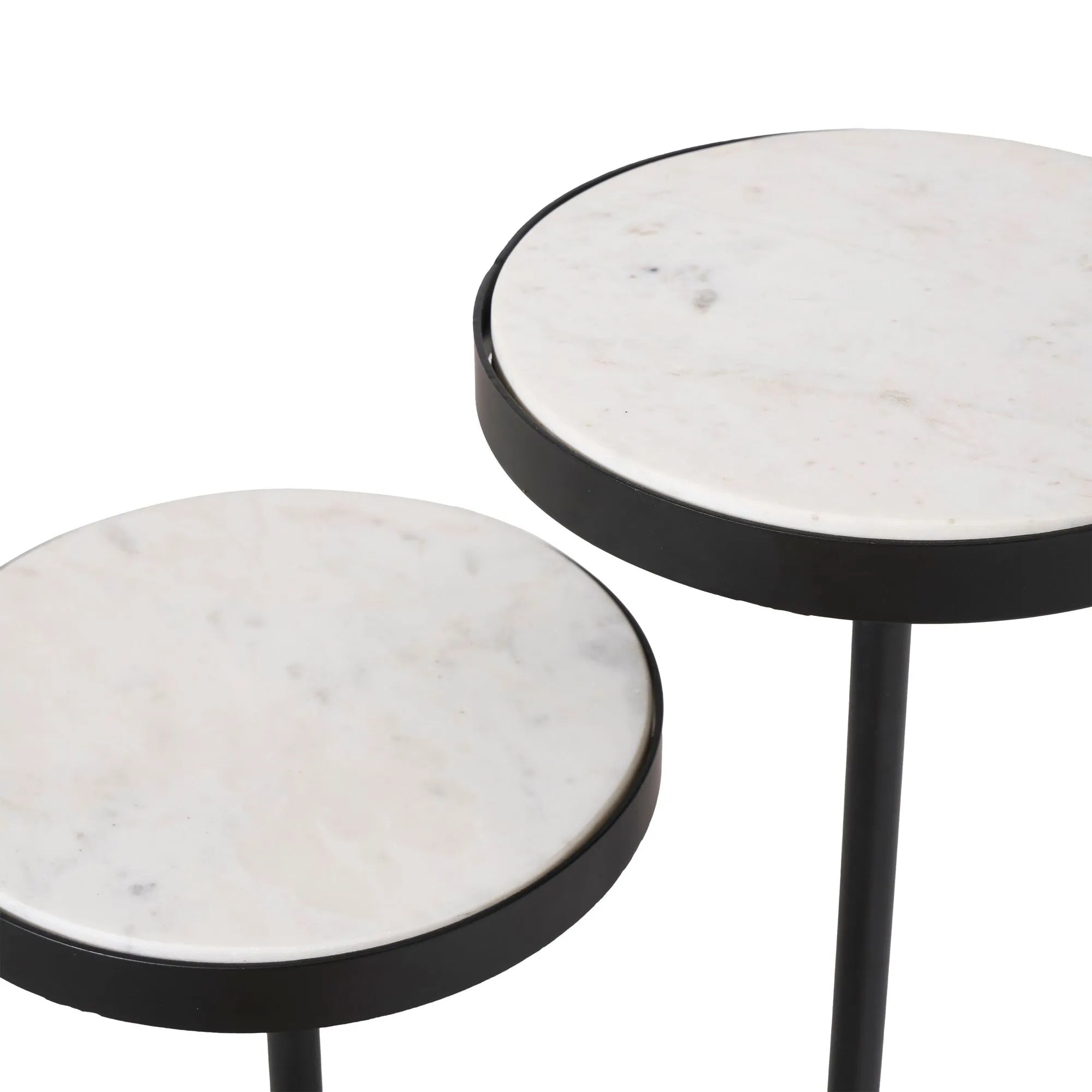 The Ambra set features two round marble side tables with white tops and black metal edges at different heights, making a striking modern accent on any white background.