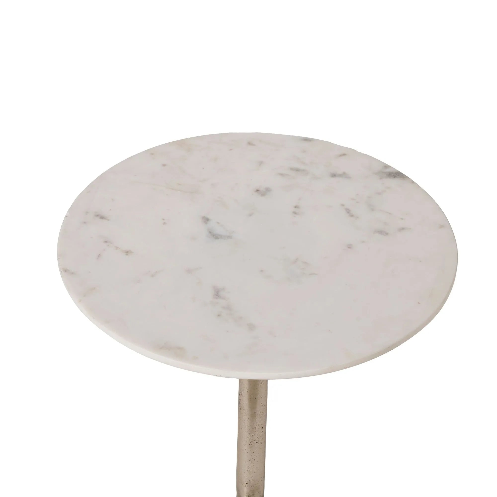 The Eloa table features a round white marble top with subtle gray veining, supported by a sleek tulip base in an antique nickel finish.