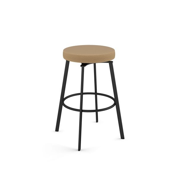 The Skyla Bar Height Swivel Stool features a round tan upholstered seat, black Canadian steel legs, and a circular footrest—ideal for commercial settings. Backless design, shown on a plain white background.
