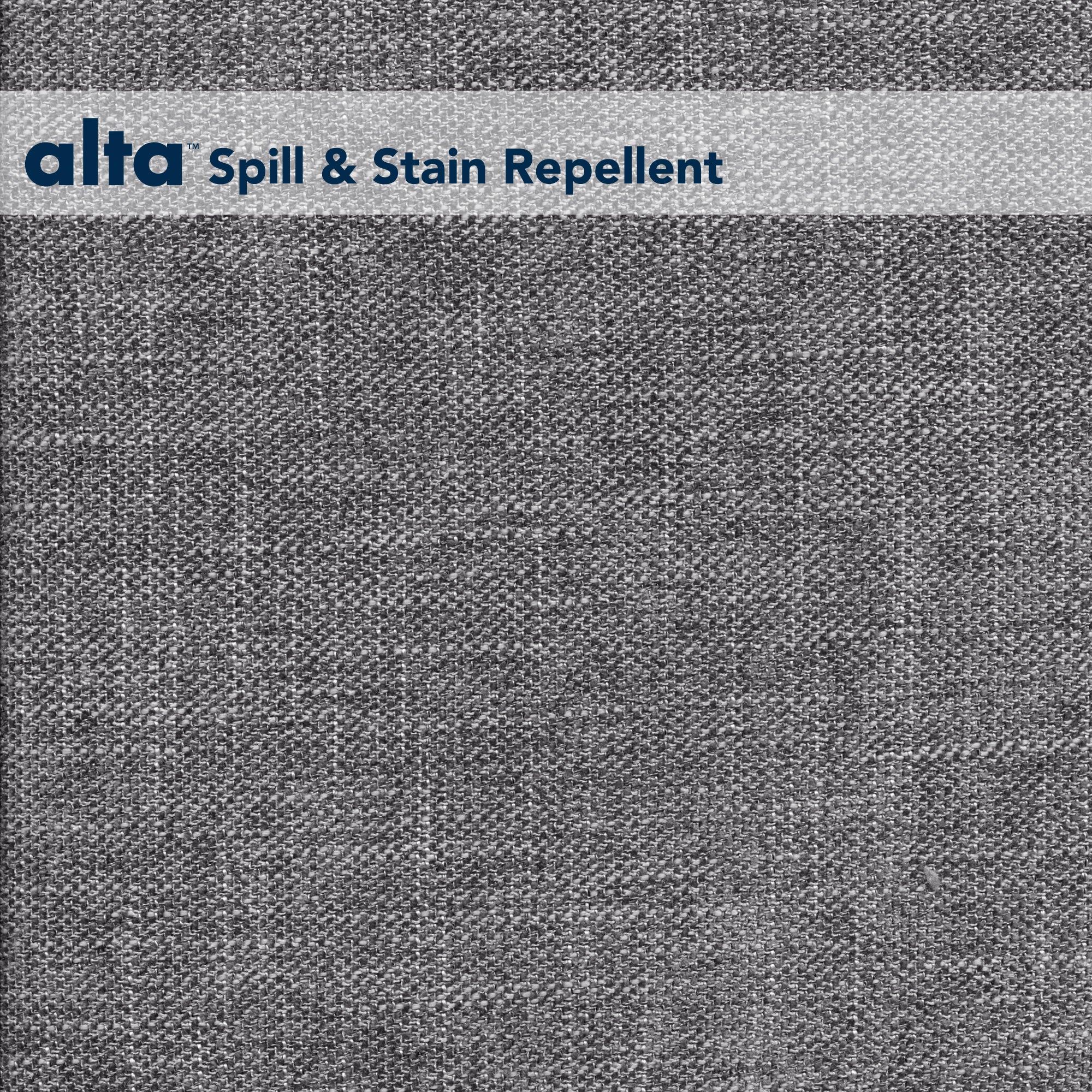 Gray textured performance fabric with a woven pattern. At the top, a white banner shows the blue alta logo and the text Spill & Stain Repellent, emphasizing Tuxedos contract-grade upholstery and stain-resistant properties.