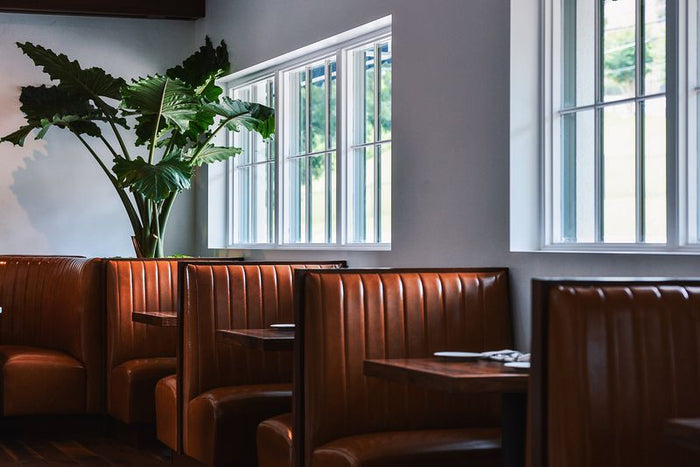 interior of the Juliet restaurant showing booths and banquettes in Austin, Texas