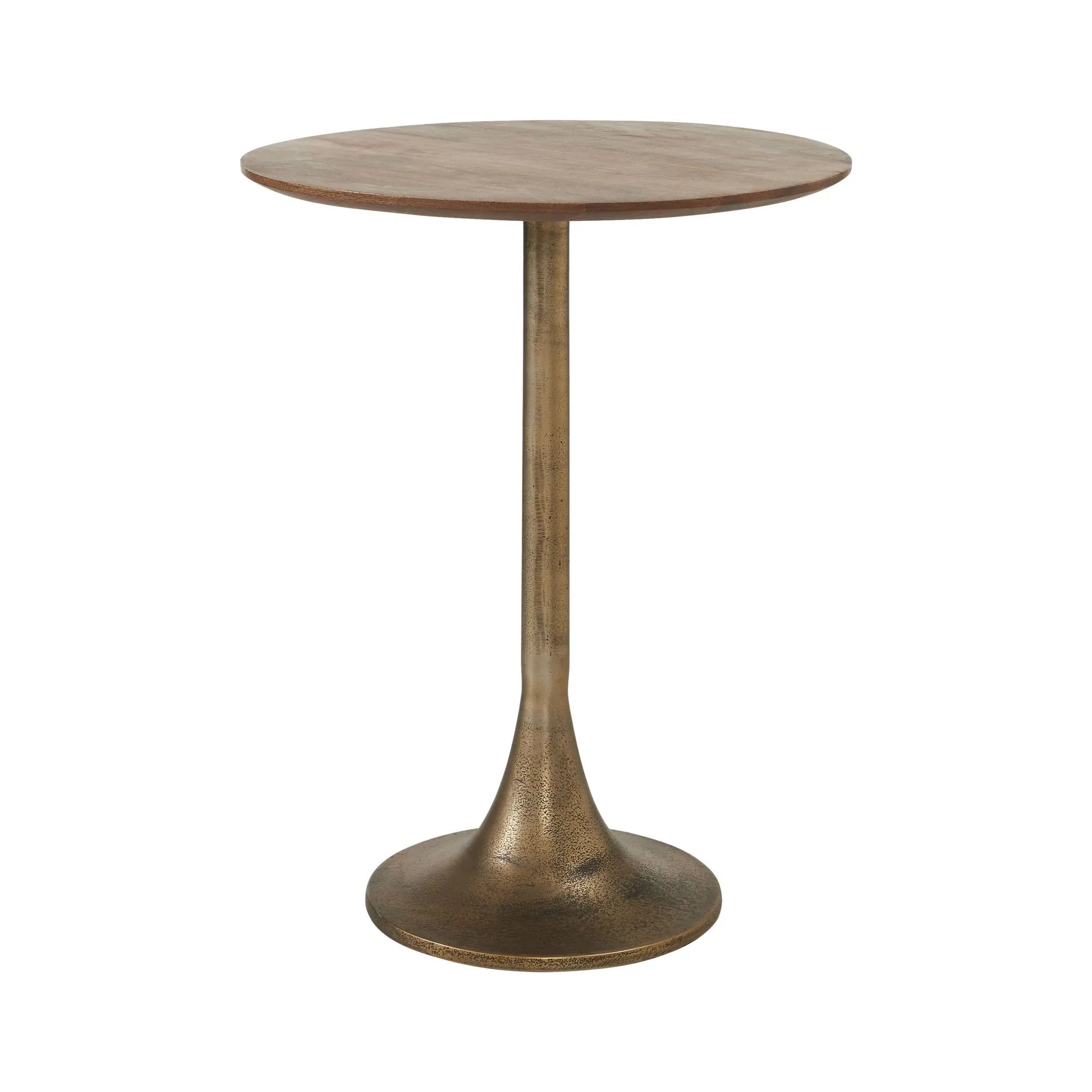 The Sparta is a small, round mango wood side table featuring a single slender tulip base in antique brass that flares elegantly at the bottom.