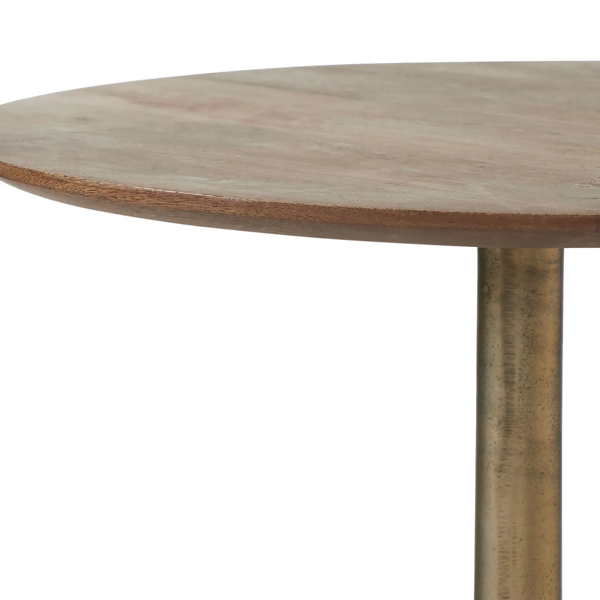 The Sparta side table features a round mango wood top with a smooth finish, supported by an antique brass tulip base, shown here against a white background.