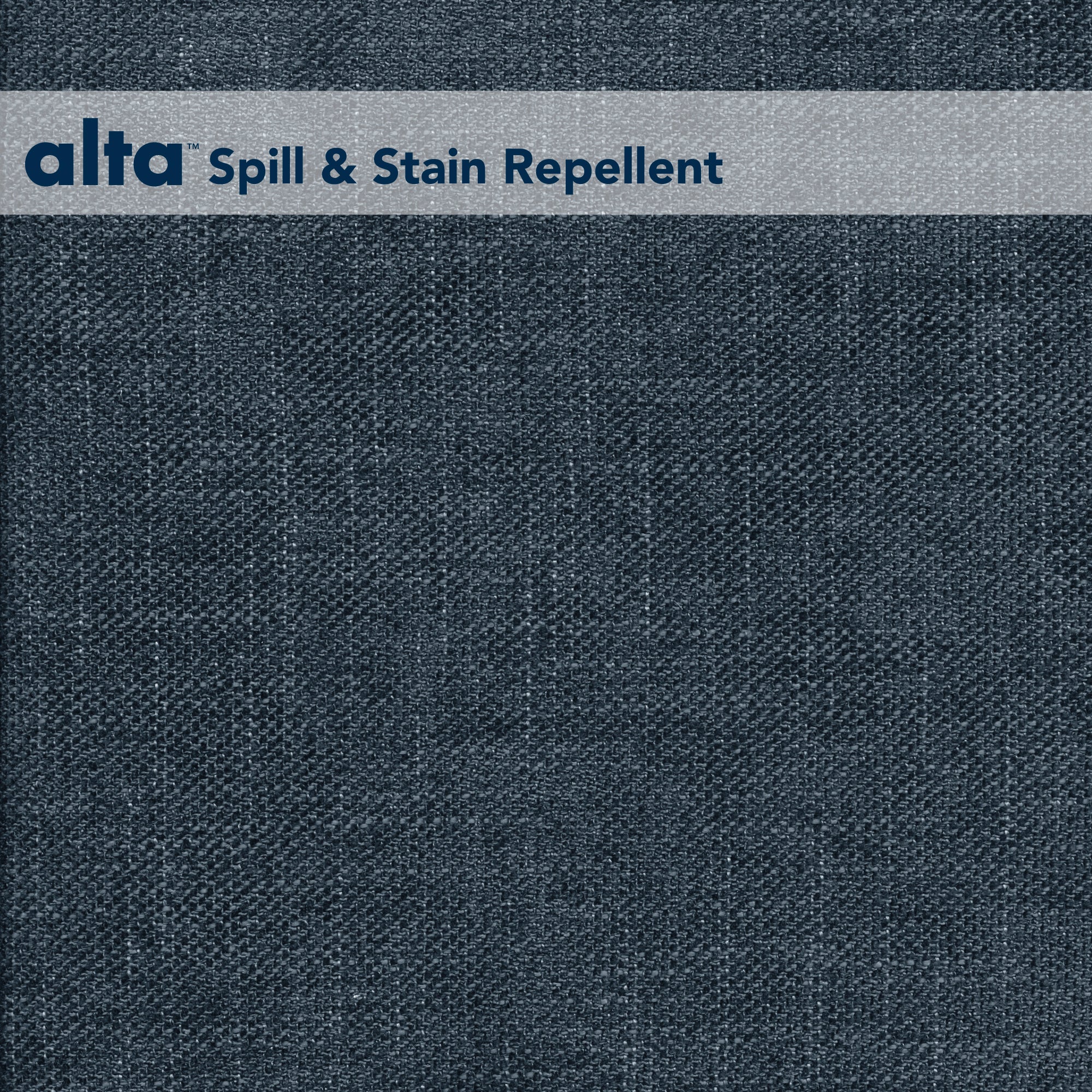 A close-up of Tuxedo dark blue performance fabric, featuring a gray strip at the top labeled alta Spill & Stain Repellent in blue text.